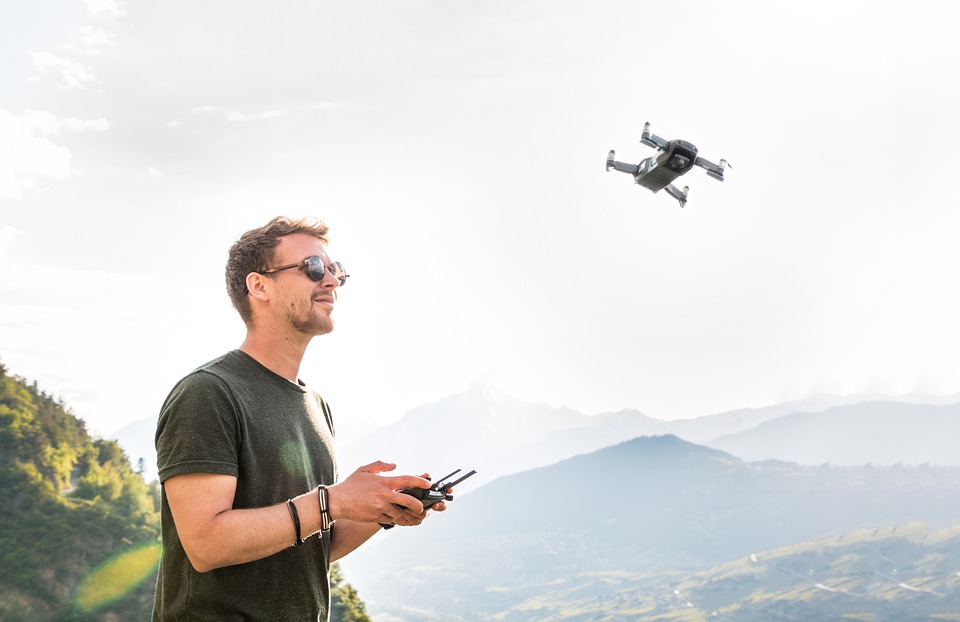 Man flying a small drone